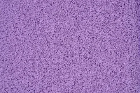 Textured Purple Surface Highlights Subtle Details and Variations in Color a.. Stock Photos