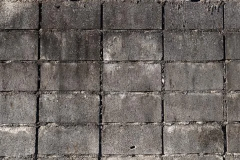 Textured rectangular grey concrete brick grunge wall background Stock Photos