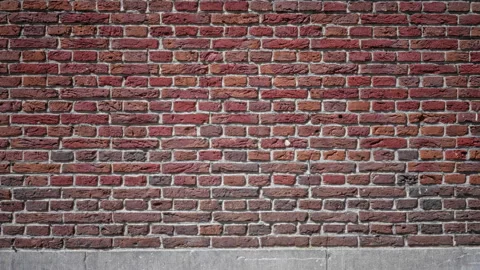 Textured red brick wall background showcasing a pattern of rustic bricks wi.. Stock Footage 313496640