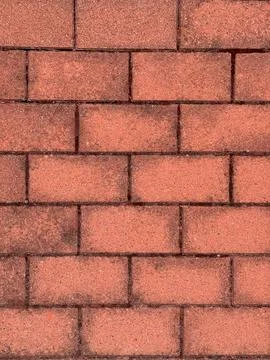 Textured Red Brick Wall. Textured red brick pavement with rough surface and.. Stock Photos