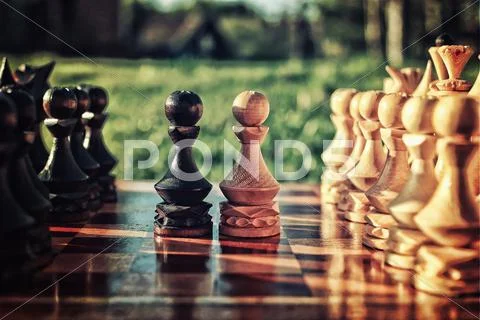 Textured retro effect photo of chess on board concept Stock Photos