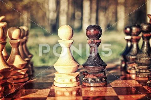 Textured retro effect photo of chess on board concept Stock Photos