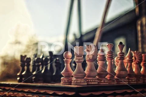 Textured retro effect photo of chess on board concept Stock Photos