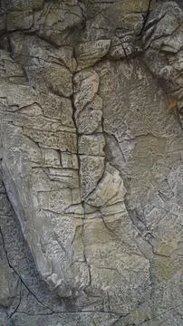 Textured Rock Surface with Cracks Stock Photos