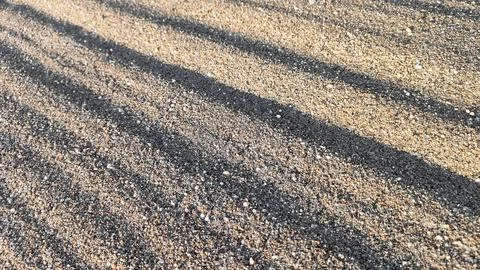 Textured sand background with diagonal lines Stock Photos