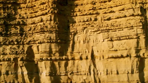 Textured sandstone cliff face moving slowly Stock Footage 336364836