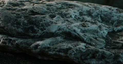 Textured Seaside Rock on Sandy Shore. Stock Footage 276092504