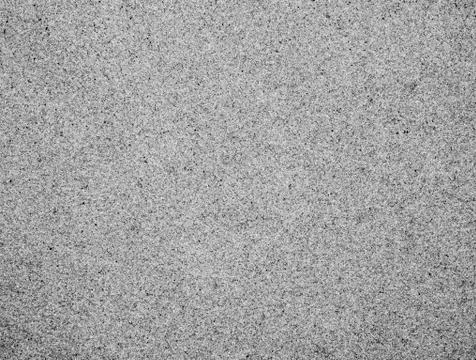 Textured smooth surface of sand. Background. Black and white image. Stock Photos