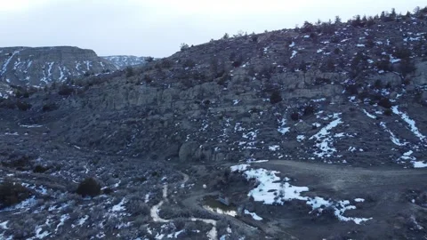 Textured snow covered landscape and hills Stock Footage 310574553