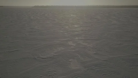 Textured snow on lake at sunset Stock Footage 85572149