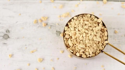 Textured soy protein granules in a measuring cup Stock Footage 335168103
