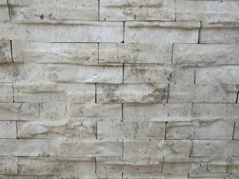 Textured stone brick wall surface Stock Photos