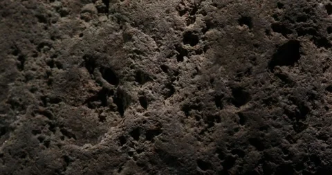 Textured Stone Surface with Light and Shadow Play Video stock 293007978