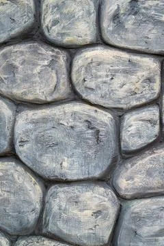 Textured stone wall featuring gray and beige tones in a rustic style Stock-Fotos