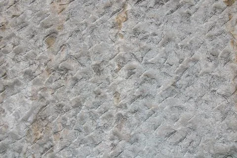 Textured stone wall with natural patterns showcasing gray tones and detaile.. Stock Photos