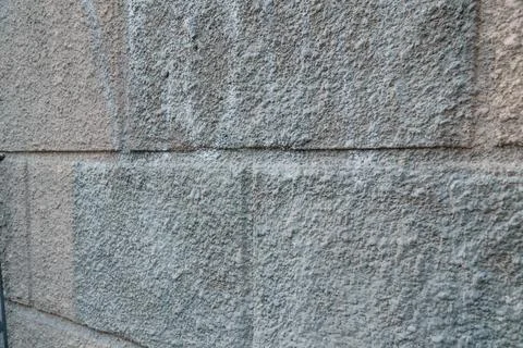 Textured Stone Wall with Subtle Variation in Shade and Surface Detail Stock Photos