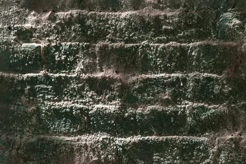 The textured surface of an aged brick wall of an underground tunnel or brid.. Stock Photos