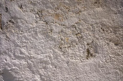 Textured surface of aged wall revealing intricate patterns and natural hues.. 스톡 사진