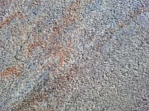 Textured surface of ceramic tile with mottled patterns in earthy tones of g.. Stock Photos