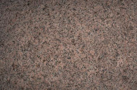 Textured surface of coarse-grained granite. 库存照片