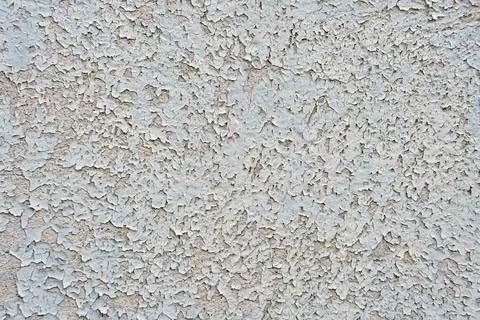 Textured surface in dark gray with visible cracks and unevenness. Stock Photos