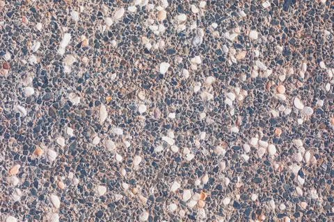 Textured surface exposed aggregate concrete Stock Photos