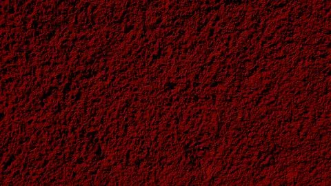 A textured surface featuring a rich deep red hue with a grainy, stone-like .. Illustration