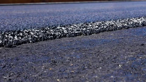 Textured surface of fresh black asphalt. Stock Footage 341109873