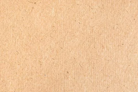 Textured surface of old brown cardboard close up Stock Photos