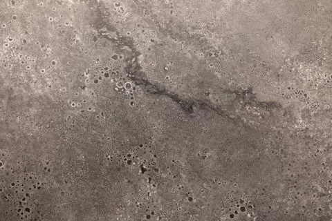 Textured surface showing intricate patterns of a gray material, ideal for Stock Photos