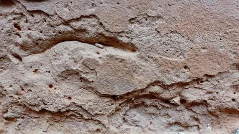 Textured Surface of Weathered Stone With Unique Patterns and Hues Stock Photos