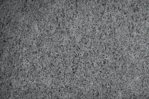 Textured surface of a white stone full of crevices. 库存照片