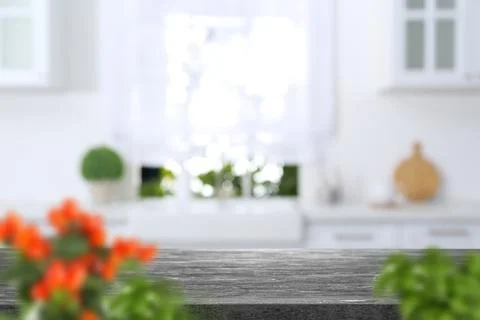 Textured table in light kitchen. Space for design Stock Photos