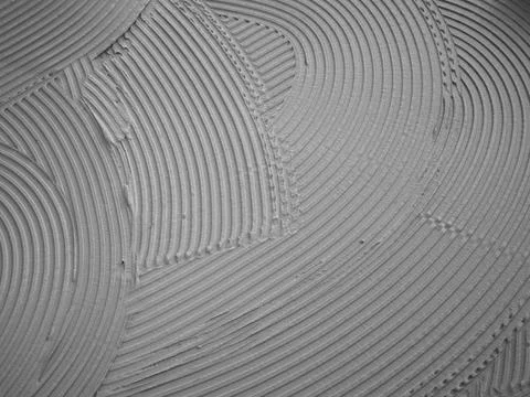 Textured Tile Mortar Surface During Professional Flooring Installation Photos