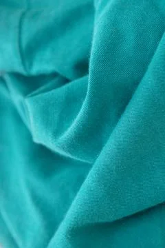 Textured turquoise cotton fabric background with selective focus Stock-Fotos