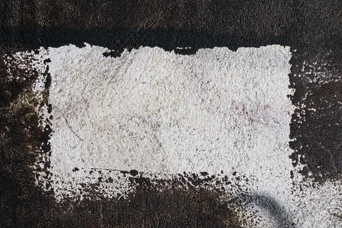 Textured wall with black rectangular frame. Stock Photos