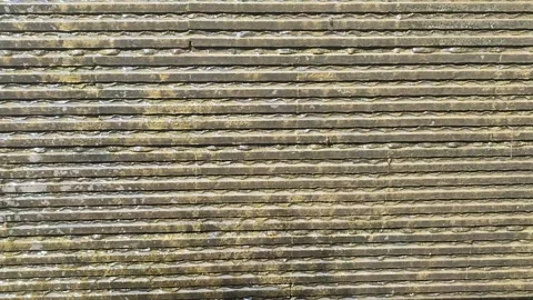 Textured Wall with Flowing Water 库存影片 334286108