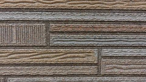 Textured Wall Panel Featuring Wood-Like Designs in Earthy Tones Stock Photos