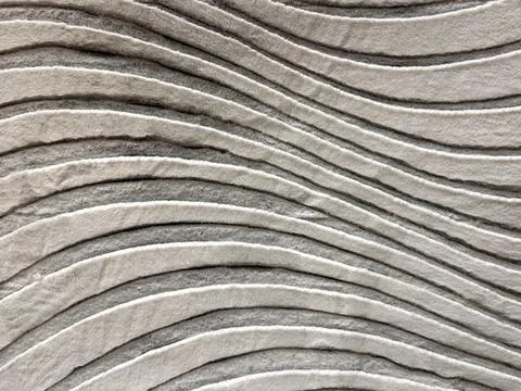 Textured Wall Panel with Wave Patterns in Gray Stock Photos