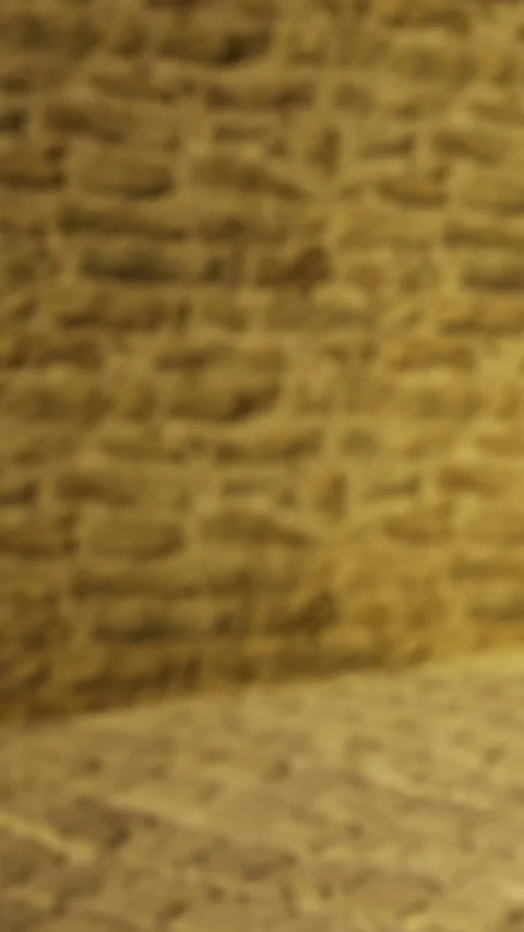 Textured wall in a room with natural light during daytime hours Stock Footage 331758417