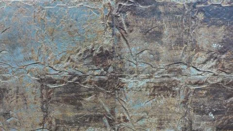 Textured Wall Surface With Intricate Patterns in Muted Blue and Brown Tones Foto stock