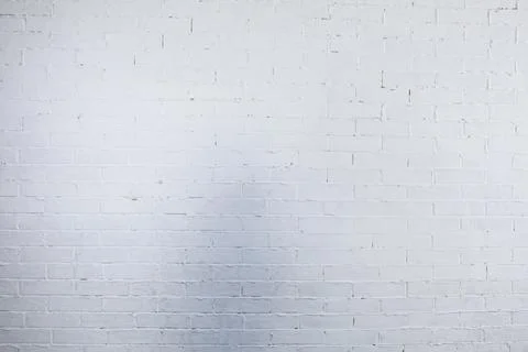A Textured White Brick Wall Background that is perfect for Creative Projects and Foto stock