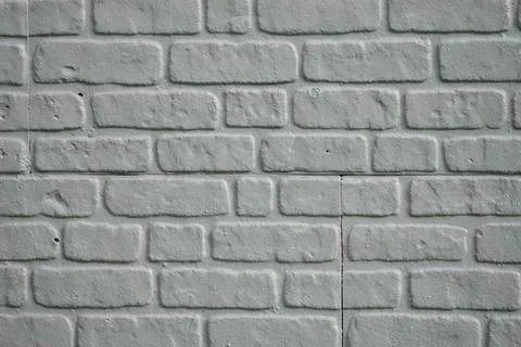 Textured white brick wall with a simple design Stock Photos