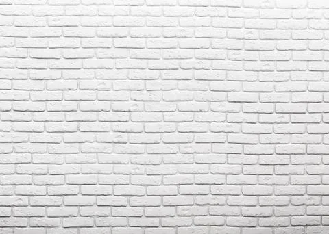 Textured white brick wall with a smooth finish, creating a modern and clean Stock Photos