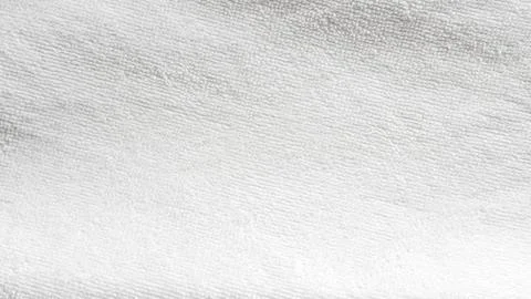 Textured white fabric background with subtle patterns and soft lighting Stock Photos