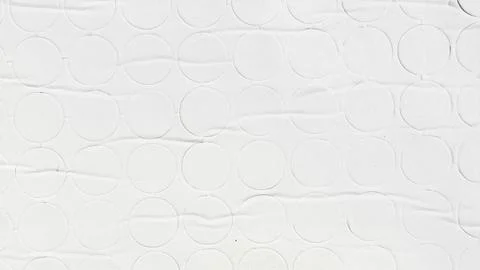 Textured white paper background showcasing a geometric pattern of embossed ci Stock Photos
