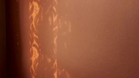 Textured Window Shadows Casting Artistic Patterns on Orange Painted Wall Surface Stock Footage 311058700