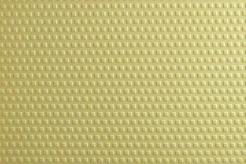 Textured Yellow Surface With Square Patterns Creating a Modern Design for V.. Stock Photos