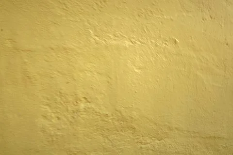 A textured yellow wall surface 写真素材
