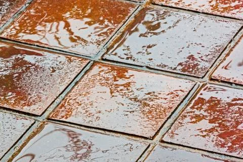 Textures and Colorful Brown and Golden Reflections on Tiles Stock Photos